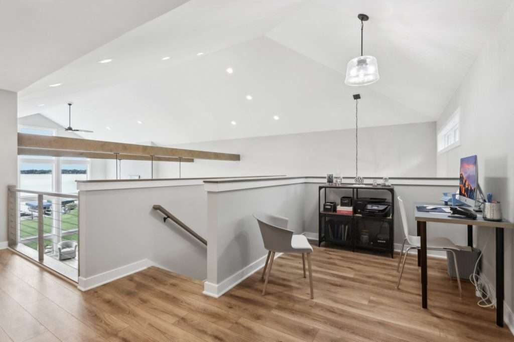 Loft with hardwood flooring